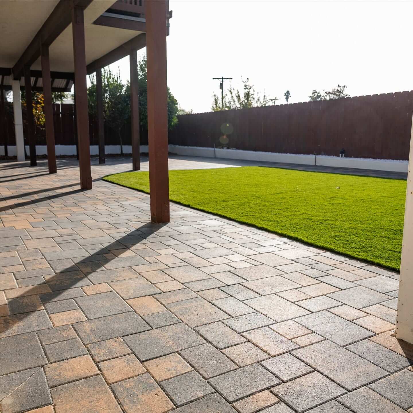 new age design and build backyard remodel turf and pavers